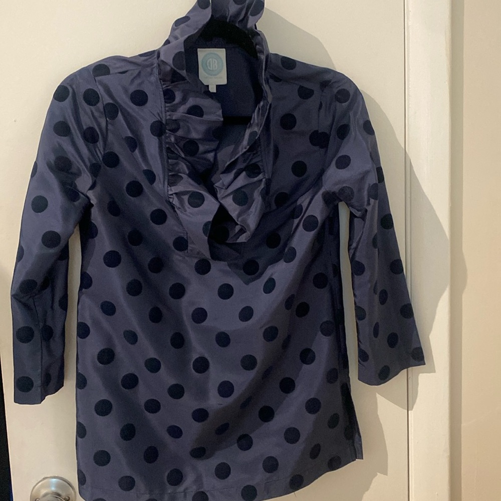 Devon Baer via Tuckernuck Navy Polka Dot Ruffle Neck Blouse